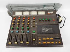 Tascam - Portastudio 244 - 4-track cassette recorder and 4-channel mixer in one portable unit,