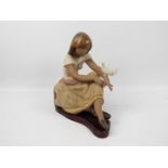 Lladro - A large gres figure group Watching The Dove, approximately 29 cm (h).