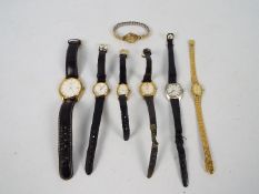 A collection of wrist watches including a 9ct gold cased lady's watch.
