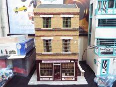 Dolls House - An Edwardian style dolls house shop 'Jennywren's Dolls House Shop'.