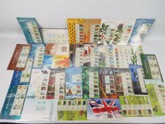Philately - Thirty Royal Mail Post & Go mint stamp presentation packs.