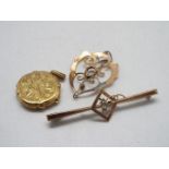 A 9ct yellow gold locket, a rose metal pendant stamped 9ct (A/F) and a bar brooch also stamped 9ct,