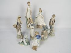 A collection of Lladro and Nao figures,