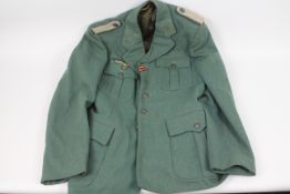 A World War Two (WW2/ WWII) style German tunic bearing Nazi insignia.