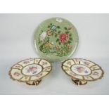 A pair of Paragon tazze with floral decorated panels bordered with blue and gilt,