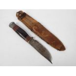 A vintage Wade & Butcher Boone hunting knife in later sheath.