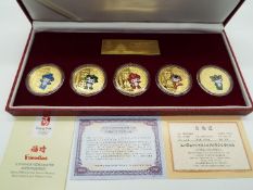 Beijing Olympics 2008 - a commemorative medallion set of five encapsulated gold-plated Fuwas