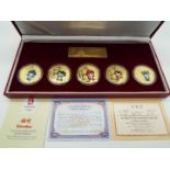 Beijing Olympics 2008 - a commemorative medallion set of five encapsulated gold-plated Fuwas