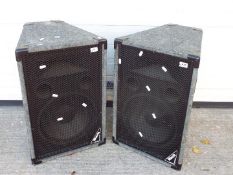 A pair of Mach passive P.A speakers with grey carpet wrap.