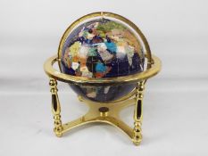 A large gemstone terrestrial globe, approximately 44 cm (h) and 46 cm (d).