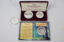 Silver Coins - A cased set of two Marshall Islands .