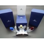 Swarovski Crystal - three large crystal tulips, red, blue, yellow in white metal display stand,