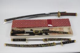A collection of reproduction Japanese Samurai swords.