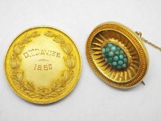 A yellow metal (presumed 22ct) and turquoise photograph brooch with safety chain 9.