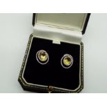 A pair of yellow Beryl and white Diamond earrings with white metal mounts stamped 18K (18 carat),