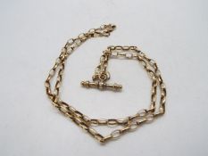 A 9ct yellow gold necklace, 54 cm (l), with 9ct gold, stone set T bar pendant, approximately 5.