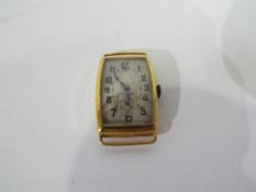 An 18ct gold cased wrist watch, lacking strap, 9.