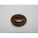 A 9ct gold, stone set, mourning brooch, approximately 6.3 grams all in.