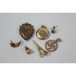 Lot to include a pair of 9ct gold earrings in the form of leaves, a further 9ct gold earring,