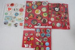 A collection of vintage pin badges to include charity, military related, promotional and similar.