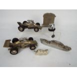 A collection of novelty cigarette lighters to include racing cars, car radiator form and similar.