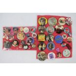 A collection of vintage pin badges relating to bands / musicians to include The Sex Pistols,