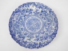 A blue and white shallow dish with shape