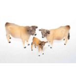 Beswick Jersey bull, cow and calf figures (3).