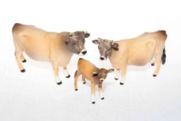 Beswick Jersey bull, cow and calf figures (3).