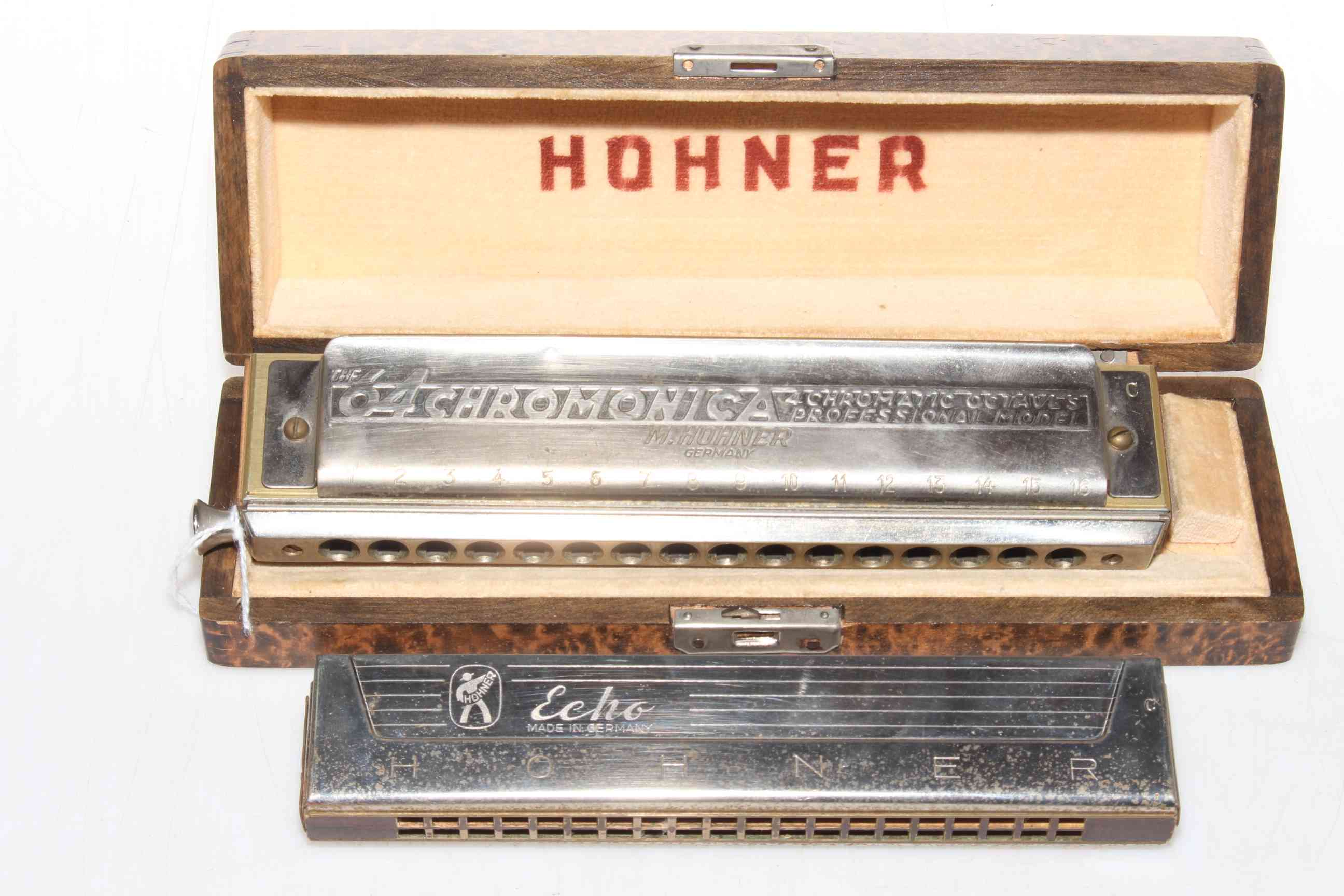 Hohner Chromonica professional harmonica and an Echo model.
