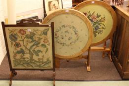 Three needlework panelled top occasional tables,