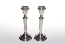 Pair of silver candlesticks with loaded bases.