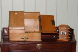 Oak slope front stationery box and a perpetual calendar.