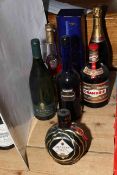 Seven bottles of assorted alcohol including two Martell Cognac, Laurent Perrier Champagne,