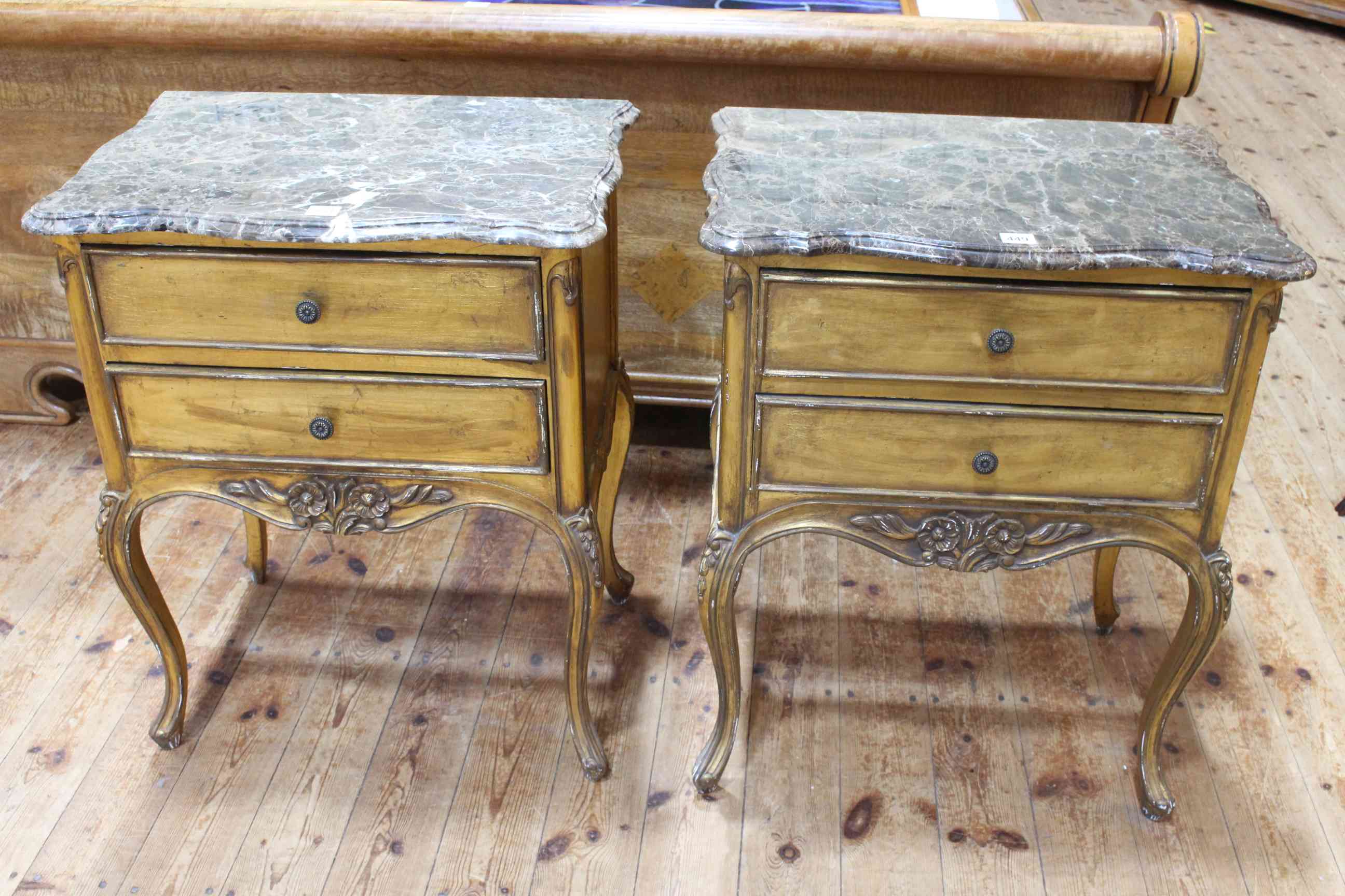 Pair gilt painted and marble topped two drawer pedestals, 73cm by 58cm by 40cm.