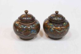 Pair of small cloisonne ovoid shaped lidded vases with bird and floral decoration.
