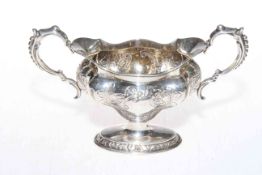 Edwardian oval twin handled silver pedestal bowl with embossed decoration, Birmingham 1905.