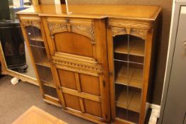 Marcus Ltd carved oak bureau centre cabinet, 117 x 124 x 37cm.