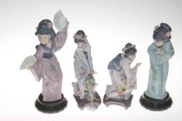 Four Lladro Japanese girl figures.