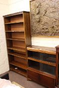 Three height sliding glazed door cabinet bookcase and seven tier oak open bookcase with adjustable