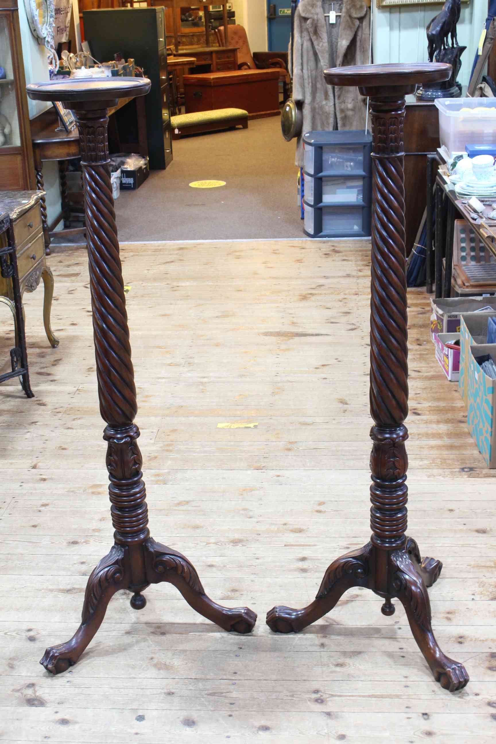 Pair mahogany carved and twist column torcheres on triform bases, 136cm.