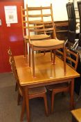 1970's teak draw leaf dining table and six ladder back chairs.