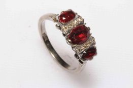 18ct white gold garnet and diamond ring, U½.