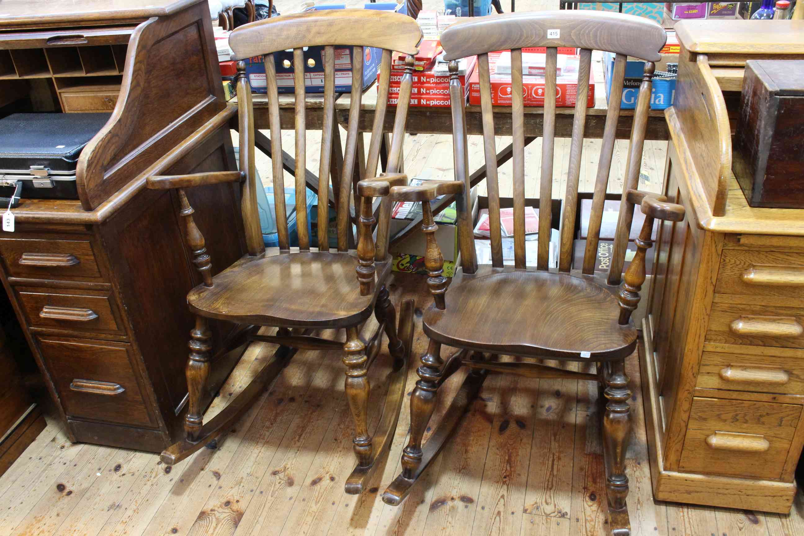 Pair farmhouse style rocking chairs.