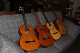 Four acoustic guitars including Almeria, Herald, Eko and Spanish.