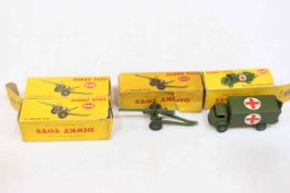 Four Dinky toys, military ambulance 626 and three medium guns 692.