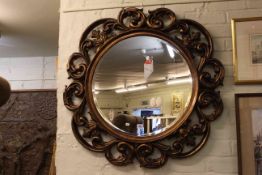 Circular gilt scrolled frame bevelled wall mirror, 90cm dia., including frame.