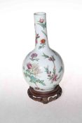 Chinese famille rose bottle neck vase on wood stand, red seal mark to base, 22cm.