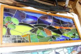 Pine framed stained glass window/panel depicting landscape, 58 x 153cm.