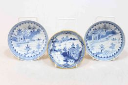 Three 18th Century Chinese blue and white saucer dishes, pair and one.